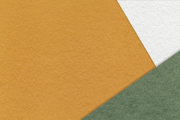 Texture de fond de papier de couleur jaune et ocre artisanal avec bordure blanche et verte Carton abstrait vintage