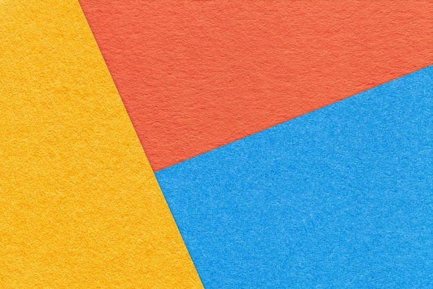 Texture de fond de papier de couleur d'ombre jaune bleu et orange artisanal Structure de carton abstrait vintage