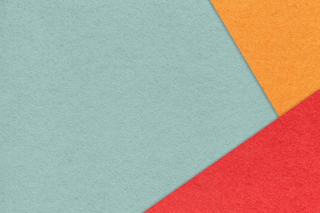 Texture de fond de papier de couleur vert pastel artisanal avec bordure rouge et orange Modèle de présentation en carton gris