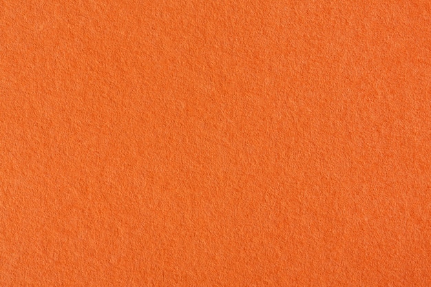 Texture de fond de papier crépon orange. Photo haute résolution.