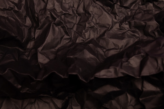 Texture ou fond de papier froissé aux tons noirs détaillés