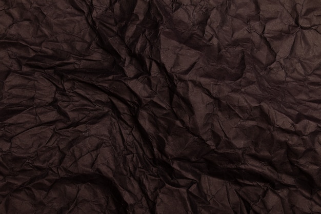 Texture ou fond de papier froissé aux tons noirs détaillés