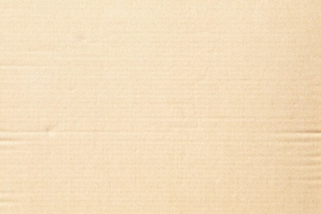 Texture de fond en papier kraft de boîte en carton brun