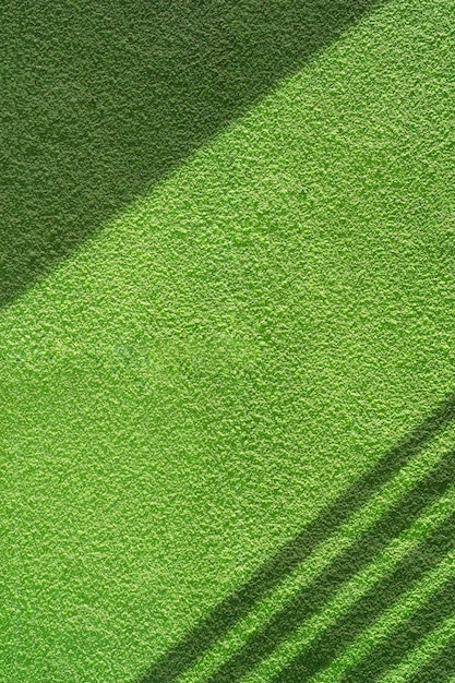 Texture de fond avec rugosité et grain de détail du mur de béton vert vintage dans un cadre vertical