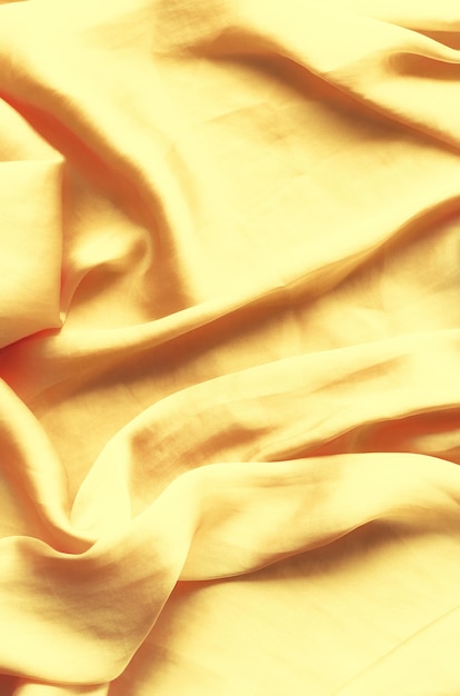 Photo texture de fond de soie dorée de luxe