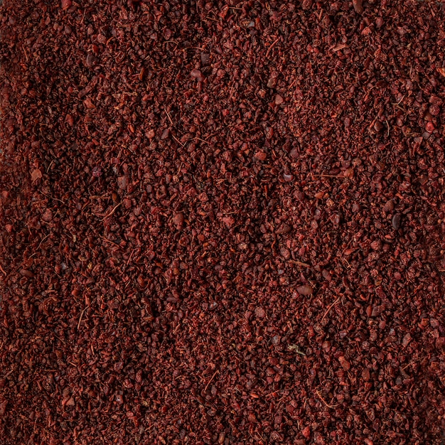 Texture de fond de sumac aux épices, aliments biologiques