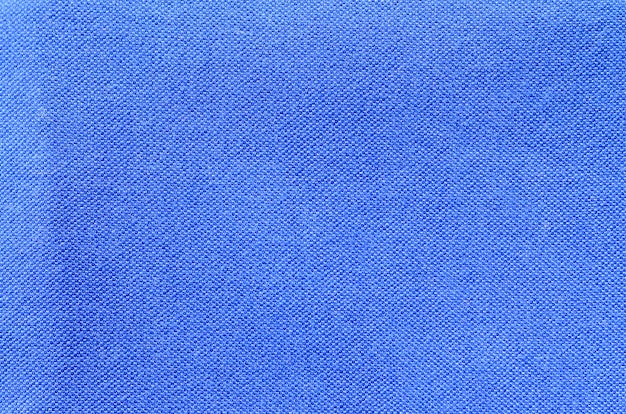 Texture et fond de vêtements de chemise de sport bleu