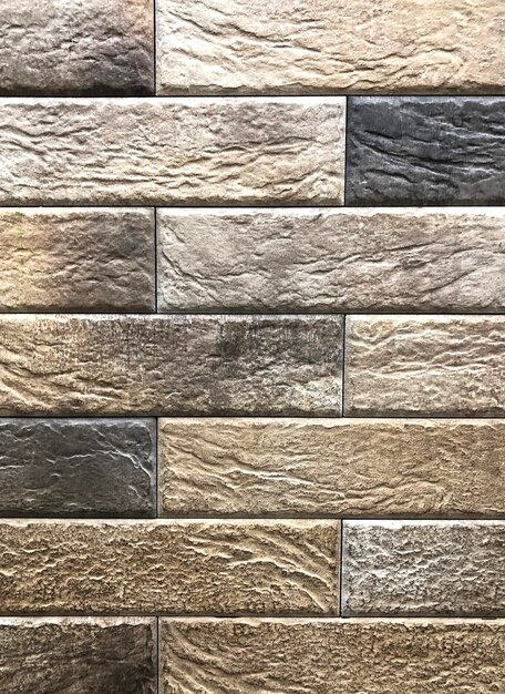 Texture de fond d'une vieille brique de couleur gris-brun utilisée pour les murs