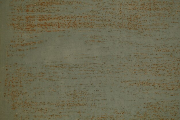 Texture de fond vieux mur gris sale avec des coups de pinceau horizontal montrant la couleur ci-dessous