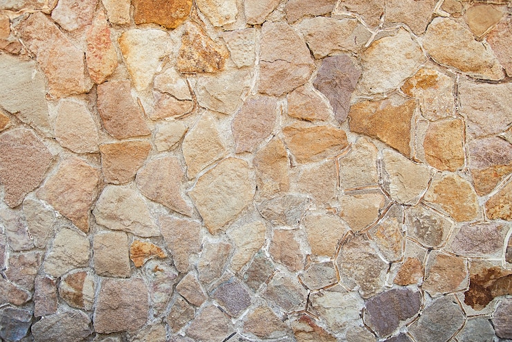 Photo texture de fond vieux mur de pierre beige