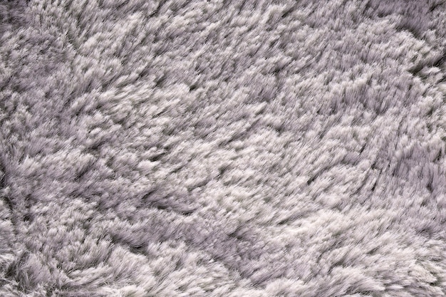 Texture de fourrure artificielle pour matériau gris moelleux gros plan