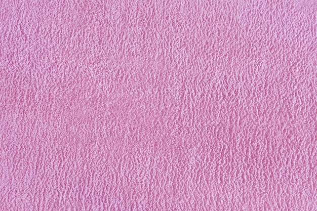 Texture de fourrure rose synthétique pour le fond.