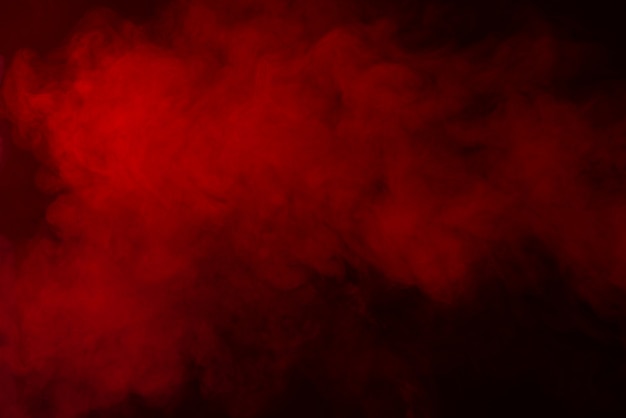 Texture de fumée rouge sur fond noir