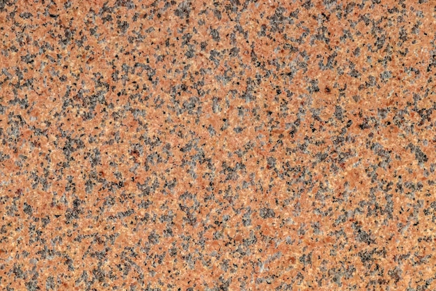 Texture de granit Base rouge avec des taches noires et grises
