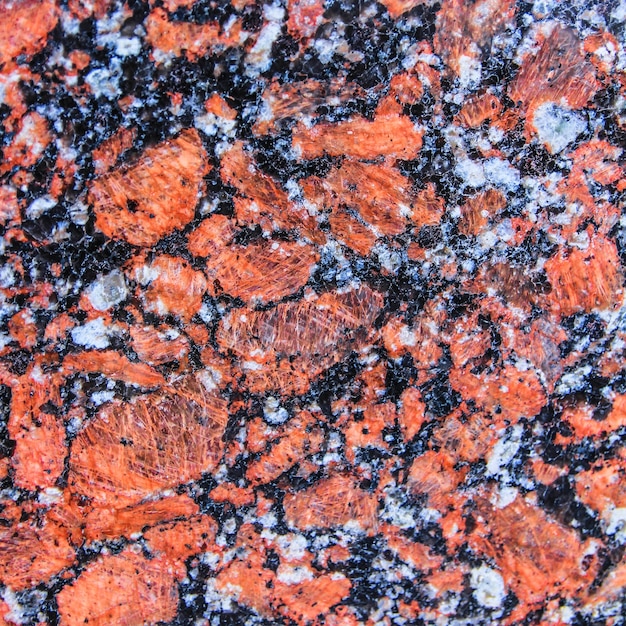 texture de granit orange, blanc et noir. Texture de pierre naturelle.