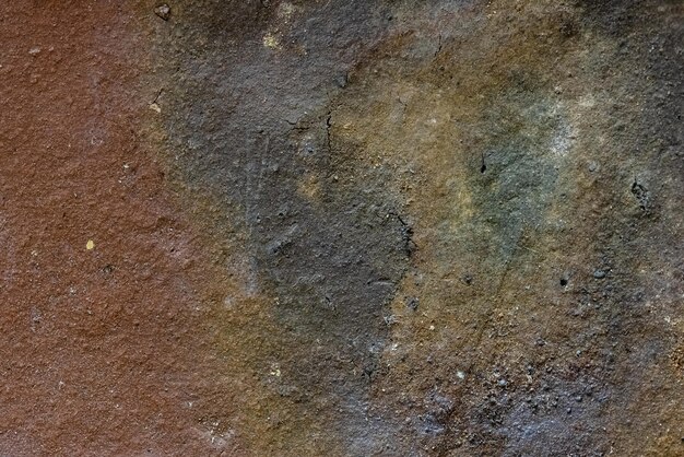 Texture en gros plan d'une brique rayée vintage noir-rouge