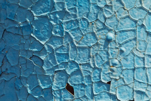 Texture de gros plan de peinture bleu craquelé