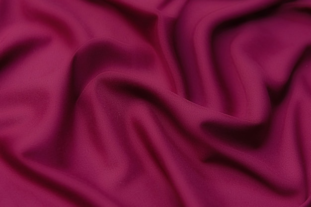 Texture de gros plan de rouge naturel. Texture de tissu de matière textile sil naturelle.