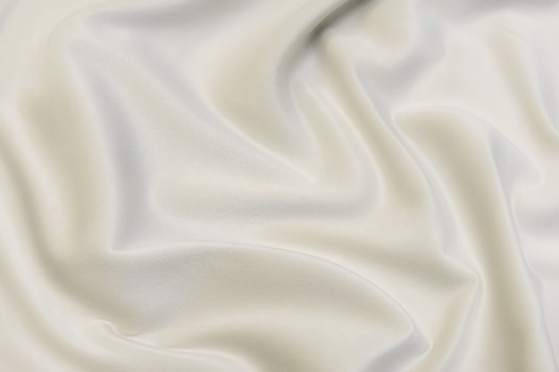Texture en gros plan de tissu beige naturel ou de tissu de couleur marron. Texture de tissu de matière textile naturelle en coton ou en lin. Fond de toile beige.