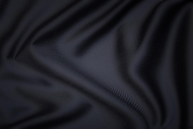 Texture en gros plan de tissu ou de tissu gris ou noir naturel de la même couleur. Texture de tissu de coton naturel, de soie ou de laine, ou de matière textile en lin. Fond de toile noire.