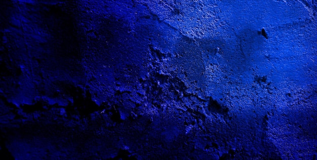 Texture grunge bleu foncé effrayant pour le concept d'horreur de mur bleu foncé de fond