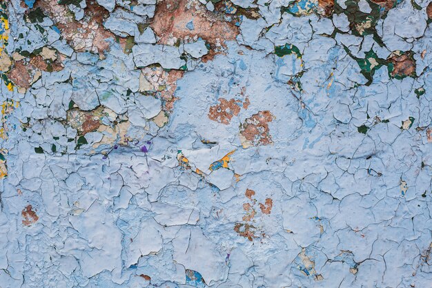 Texture grunge fond de mur en pierre de béton avec peinture écaillée de couleur bleue