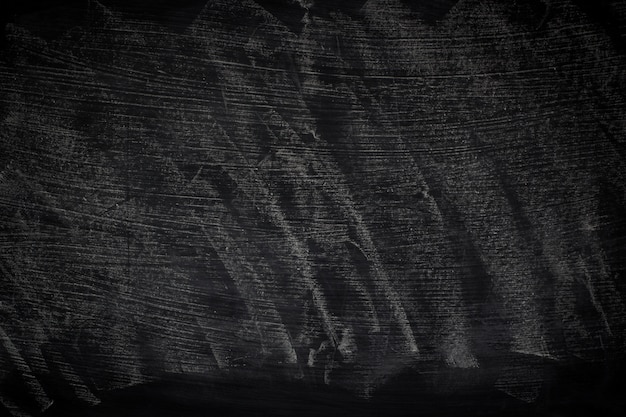 Texture grunge noire avec la surface. Craie abstraite effacée sur tableau noir.