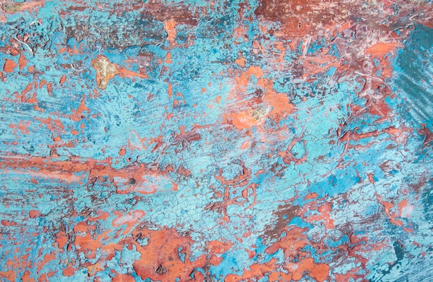 Texture grunge, peinture bleue et orange s'écaillant de l'arrière-plan de la surface en fibre de verre