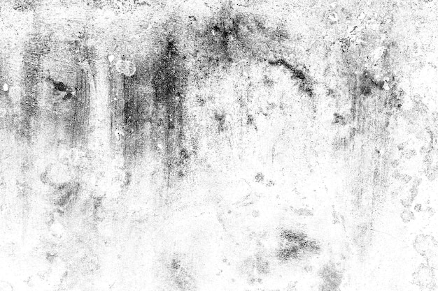 Texture grunge sombre dispersée sur la surface du mur de plâtre blanc