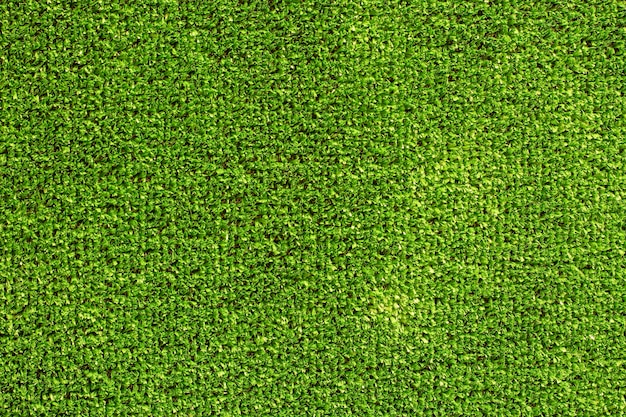 Texture d'herbe artificielle verte en gros plan