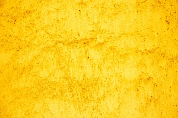 Photo une texture jaune d'un mur avec une texture de peinture jaune