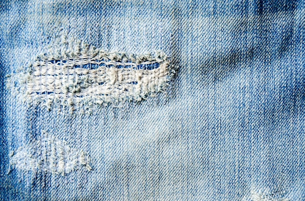 Texture de jeans manque et blue jeans sur le plancher en bois