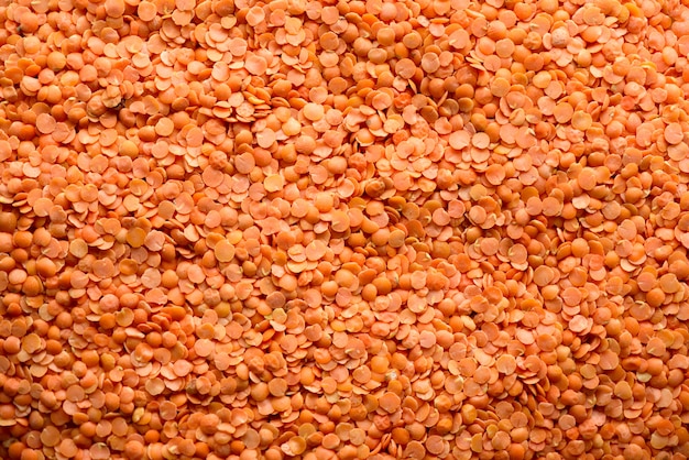 Texture de lentilles biologiques brutes rouges. Ingrédient alimentaire. Vue de dessus