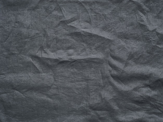 Texture de lin gris comme arrière-plan. Nappe froissée en lin gris.