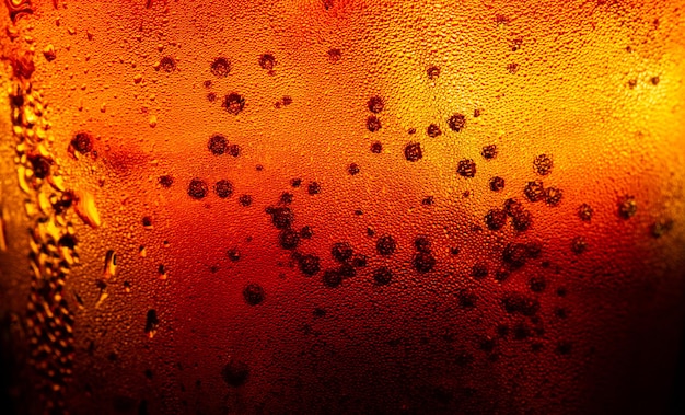 Texture macro cola, cola avec fond de nourriture glacée, gros plan de cola, élément de conception. macro bulles de bière,