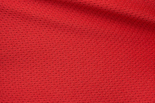 Texture de maillot de football de tissu de vêtements de sport rouge bouchent