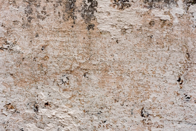 Texture d&#39;un mur de béton avec des fissures et des rayures