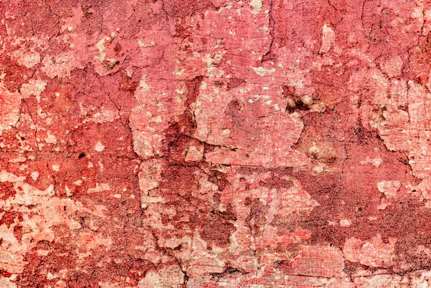 Texture d'un mur de béton avec des fissures et des rayures