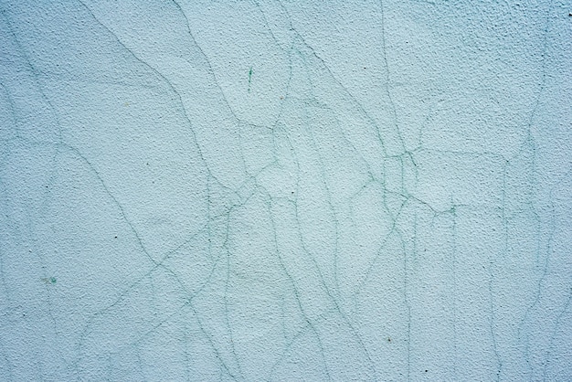 Texture d'un mur de béton avec fond de fissures et rayures