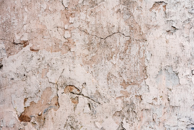 Texture, mur, béton, il peut être utilisé comme arrière-plan. Fragment de mur avec rayures et fissures