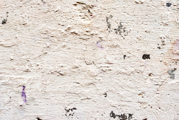 Texture, mur, béton, il peut être utilisé comme arrière-plan. Fragment de mur avec des rayures et des fissures
