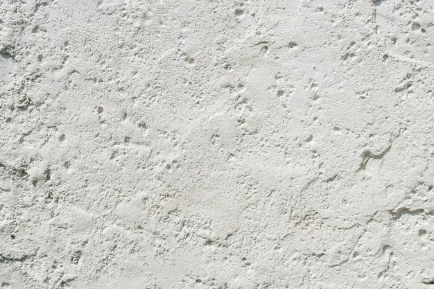 Texture de mur blanc prise en gros plan à l'extérieur