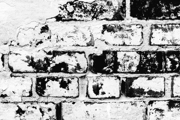 Texture d'un mur de briques avec des fissures et des rayures qui peuvent être utilisées comme arrière-plan