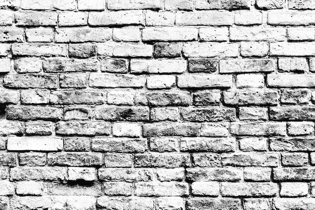 Texture d'un mur de briques avec des fissures et des rayures qui peuvent être utilisées comme arrière-plan