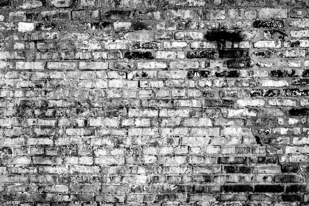 Texture d'un mur de briques avec fond de fissures et de rayures