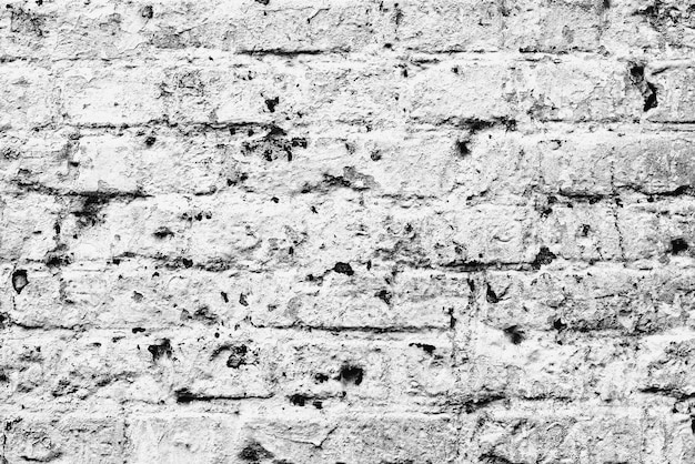 Texture d'un mur de briques avec fond de fissures et de rayures