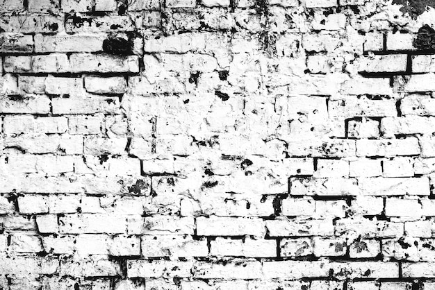 Texture d'un mur de briques avec fond de fissures et de rayures