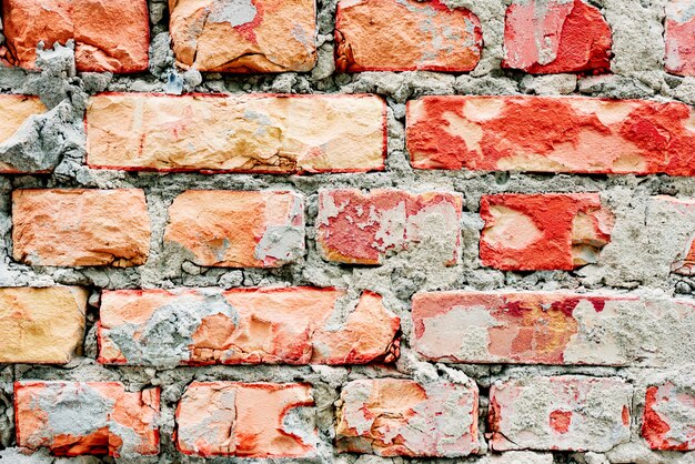 Texture d&#39;un mur de briques avec fond de fissures et rayures