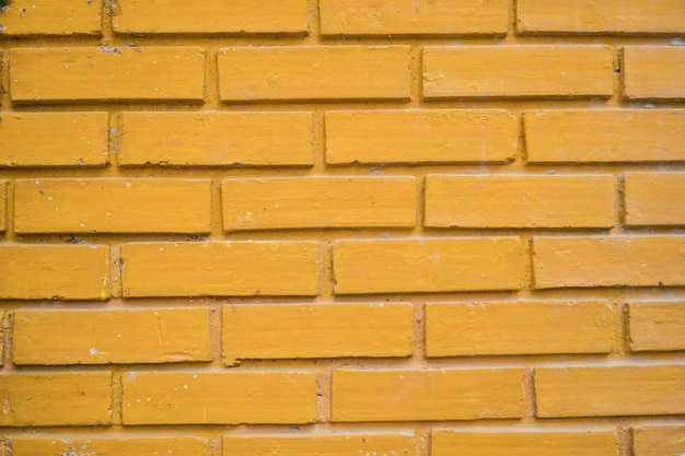 Photo texture de mur en briques jaunes