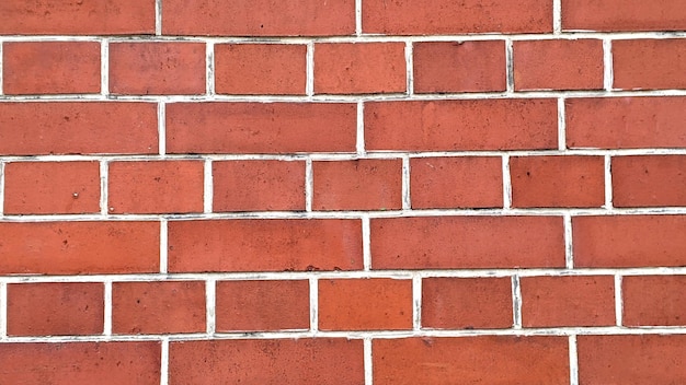 Texture de mur en briques rouges ou fond de mur de briques pour l'intérieur